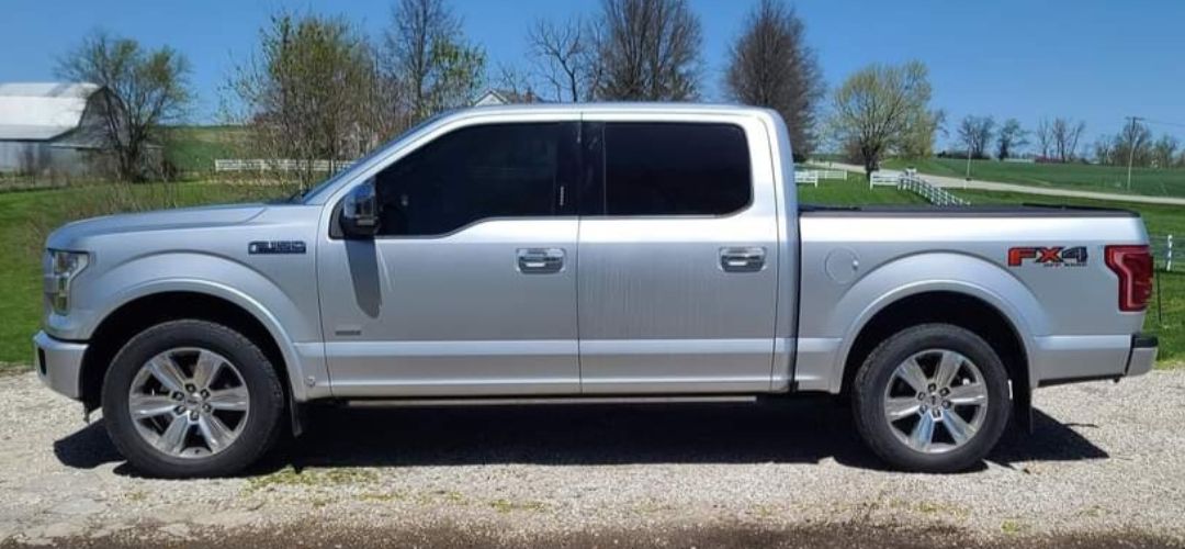 silver semi truck window tinted at Elite Auto Tint left side